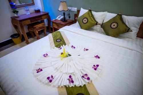 Postel nebo postele na pokoji v ubytování NKS Hotel