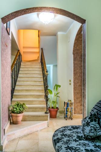 a staircase in a home with potted plants at Pyramids View Inn in Cairo