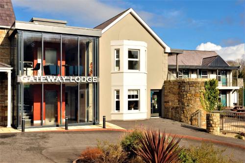 a building with a sign that reads gateway edge at The Gateway Lodge in Donegal