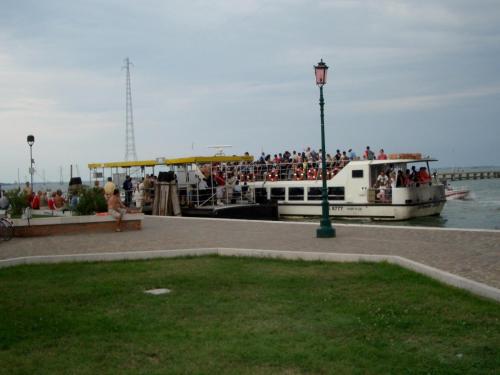 a group of people on a boat on the water at Relais Alcova del Doge in Mira