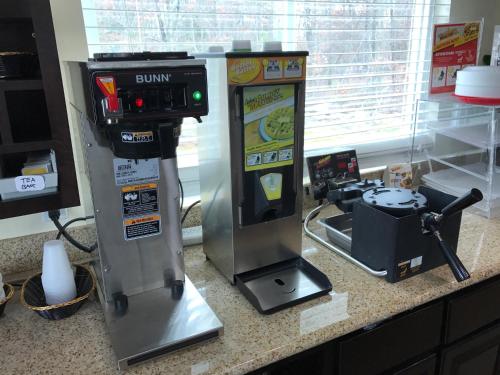a drink machine sitting on top of a counter at Crystal Inn and Suites in Galloway