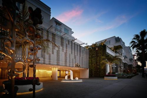 a building with a sculpture in front of it at AKA Beverly Hills in Los Angeles