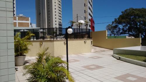 a street light in a city with tall buildings at Aptos Privativos Vista Mar Hotel Paradise Flat in Natal