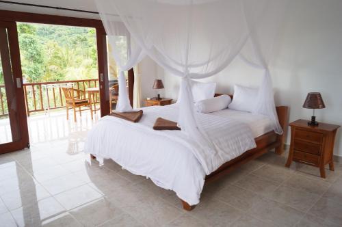 Letto o letti in una camera di Villa Mangga Beach