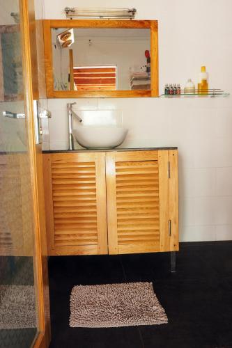 a bathroom with a sink and a mirror at Luckydaisy Buffalo House in Sapa