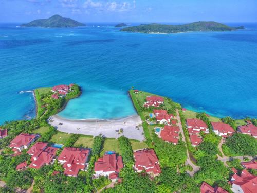 an aerial view of a island with houses and the ocean at Eden Island Luxury Accommodation in Eden Island