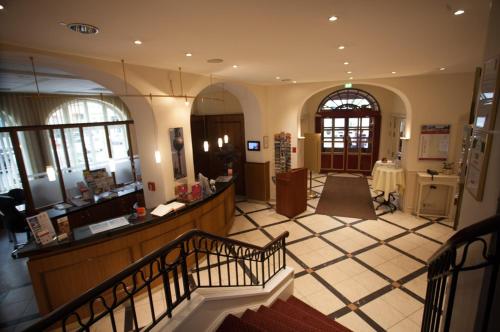 a lobby of a building with a lobbyasteryasteryasteryasteryasteryasteryasteryastery at martas Hotel Albrechtshof Berlin in Berlin