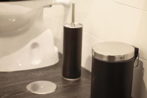 a trash can sitting on a counter next to a sink at Los Guardeses in Solares