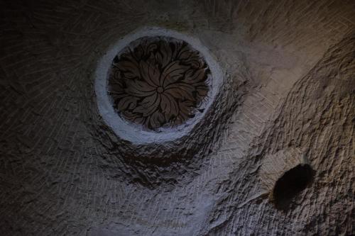 a view from the top of a wooden floor with a spiral at Anatolia cave hotel Pension in Goreme