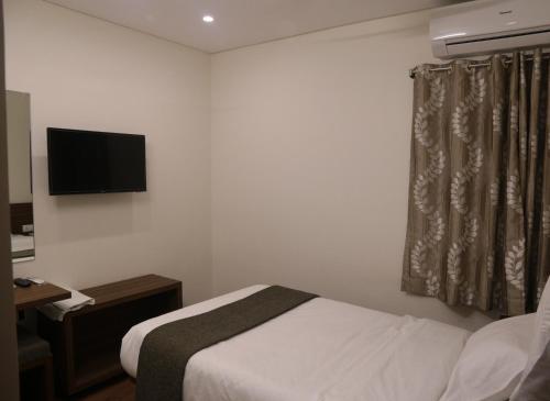 Ein Bett oder Betten in einem Zimmer der Unterkunft Avea Accommodation