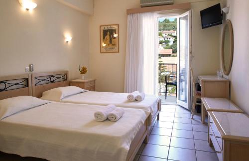 Postel nebo postele na pokoji v ubytování Mentor Hotel