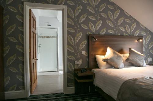 Postel nebo postele na pokoji v ubytování Manor Parc Hotel