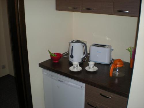 a kitchen counter with a appliance on top of it at Hostel Lux in Kaunas