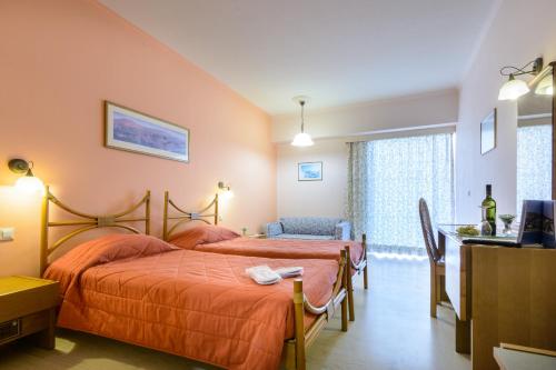 Postel nebo postele na pokoji v ubytování Golden Sand Hotel