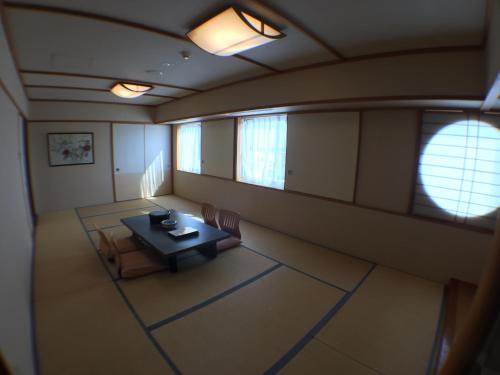 an overhead view of a room with a table and chairs at Hotel Okhotsk Palace in Mombetsu