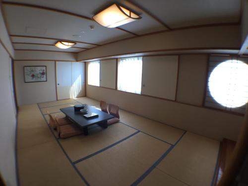 an overhead view of a room with a table and chairs at Hotel Okhotsk Palace in Mombetsu