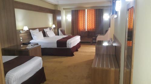 Postel nebo postele na pokoji v ubytování Numidien Hotel