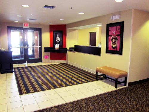 a lobby with a waiting room with a bench in it at Extended Stay America Suites - Livermore - Airway Blvd in Livermore