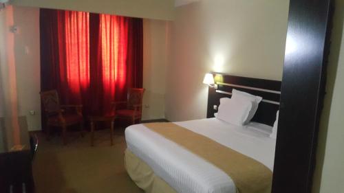 Postel nebo postele na pokoji v ubytování Numidien Hotel