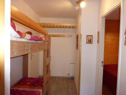 two bunk beds in a room with a hallway at Chalanche in Barcelonnette