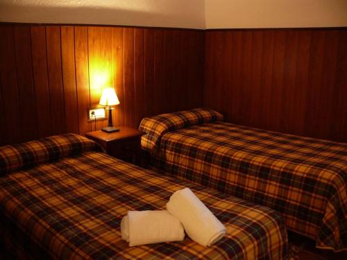 Кровать или кровати в номере Telecabina las Catifas