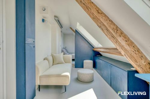 Bright studio with a view over the rooftops of Paris 9th