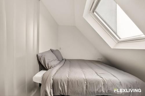 Bright studio with a view over the rooftops of Paris 9th