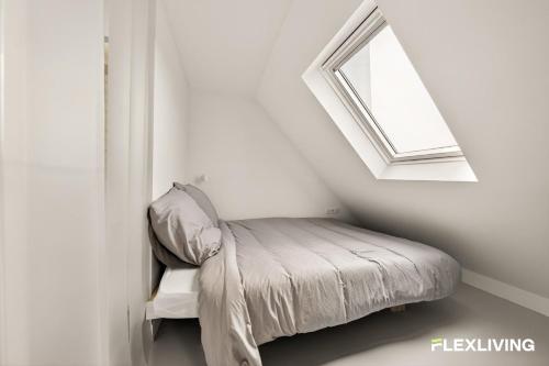 Bright studio with a view over the rooftops of Paris 9th