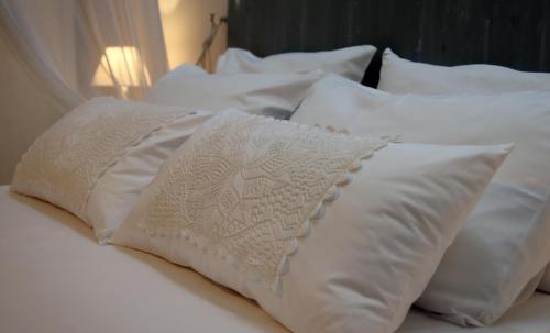 Una cama o camas en una habitación de Villa Meli-milon