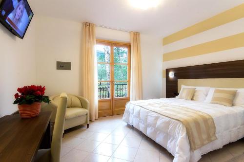 Ένα ή περισσότερα κρεβάτια σε δωμάτιο στο Albergo Ristorante San Matteo