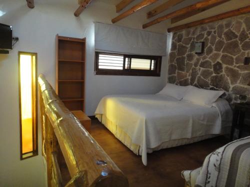 Ένα ή περισσότερα κρεβάτια σε δωμάτιο στο Hotel Parina Atacama