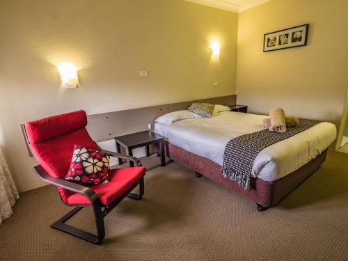 Ένα ή περισσότερα κρεβάτια σε δωμάτιο στο Casino Motor Inn