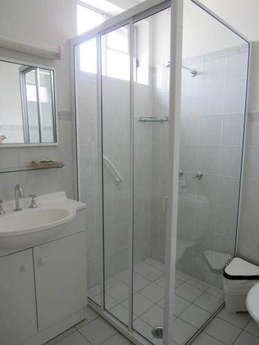 a bathroom with a shower and a sink at Casino Motor Inn in Casino