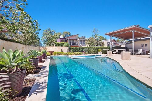 a swimming pool in the backyard of a house at Peppers Hunter Valley - formerly Grand Mercure in Pokolbin