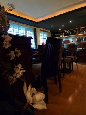a dining room with a chair and a bar at Villa High Wharf in Wanli District