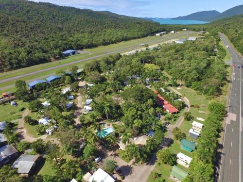 an aerial view of a campground with trees and a road at BIG4 Whitsundays Tropical Eco Resort in Airlie Beach