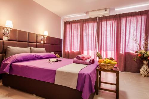 Ένα ή περισσότερα κρεβάτια σε δωμάτιο στο Porto Dailiani