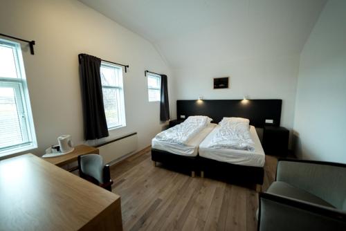 Een bed of bedden in een kamer bij Dæli Guesthouse