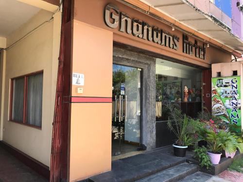 a store front with a sign on the door at Gnaanams Hotel and Restaurant in Jaffna