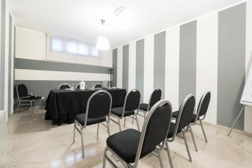 a meeting room with a table and chairs at Hotel Garibaldi in Palermo