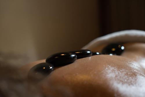 a close up of a person wearing a black bead necklace at Filoxenia Hotel & Spa in Kalavrita
