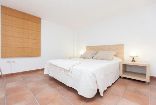 מיטה או מיטות בחדר ב-Stay Barcelona Vila de Gracia