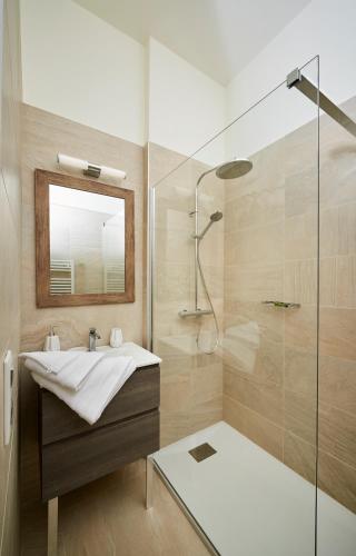 a bathroom with a sink and a shower at Bubble 8 in Épernay