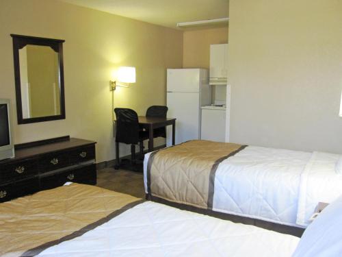 a hotel room with two beds and a mirror at Extended Stay America Suites - Nashville - Brentwood - South in Brentwood
