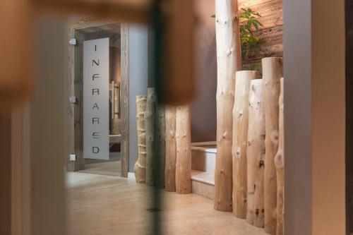 a view of a room with a hallway with a mirror at Hotel Chalet S - Dolomites Design - adults recommended in Selva di Val Gardena