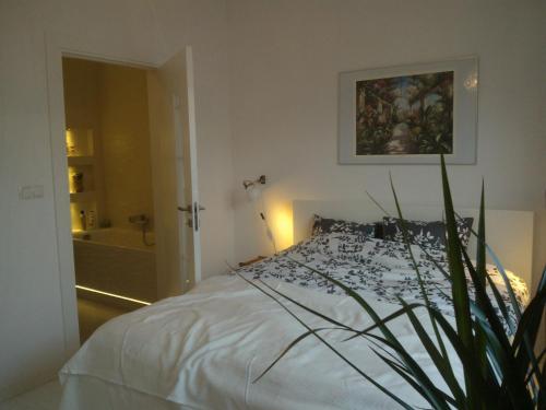 En eller flere senge i et værelse på Luxury Apartment - Hoza 55