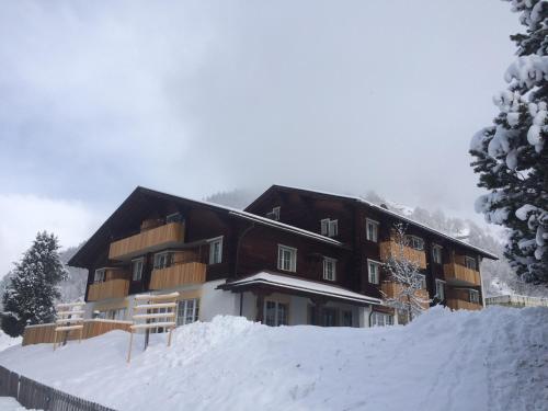 a large building with snow in front of it at Medelina in Curaglia