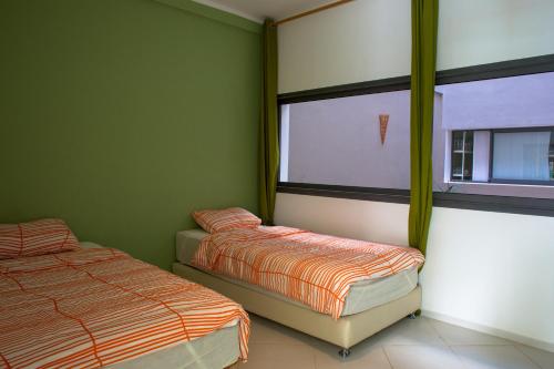 A bed or beds in a room at Wind House