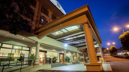 a large building with a large balcony in front of it at Hotel Seri Malaysia Genting Highlands in Genting Highlands