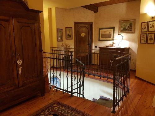 a hallway with a staircase in a house at Bed And Breakfast Olimpia in San Salvatore Monferrato